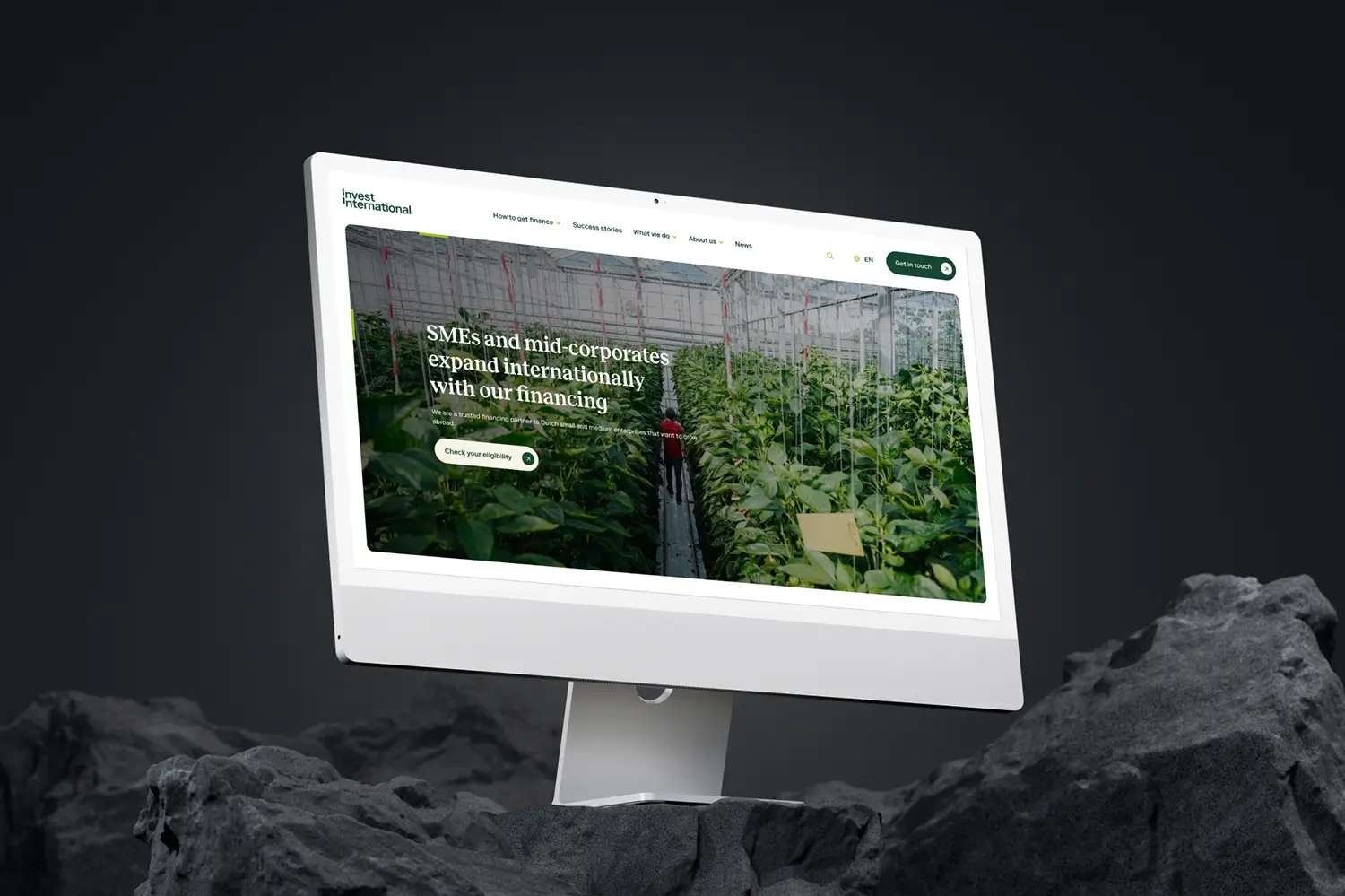 iMac mockup with Invest International website